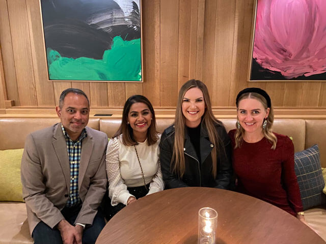 People smiling at a Holiday Party